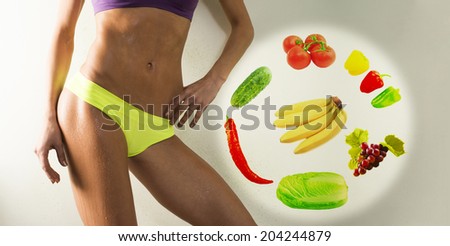 young sporty wet slim woman legs with hand No face Unrecognizable person fitness girl, torso of sport young girl with perfect body, studio shot  Near female very healthy vegetable and fruit
