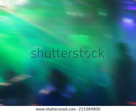 Background of De-focused concert crowd. Green light indoor