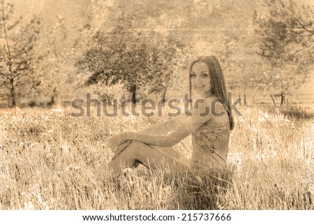 Full length portrait of beautiful young woman lying on a meadow against white flower on apple tree Cute slim girl in gray dress looking up and enjoying Empty Copy space for inscription