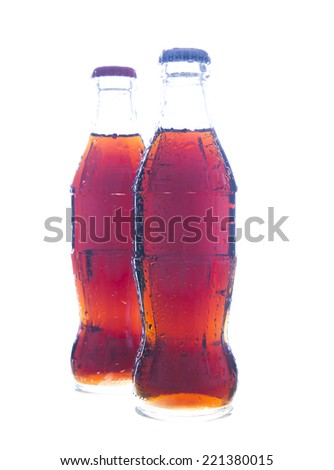 Two Object of full bottle with transparent drops of coca soda cola  isolated on a white background Wet jar without label fresh brown or black drink