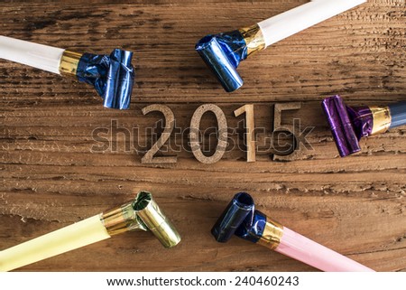 NYE Background: 2015 New Years Eve golden numbers decorations on old retro vintage aged wood backdrop Empty copy space for inscription