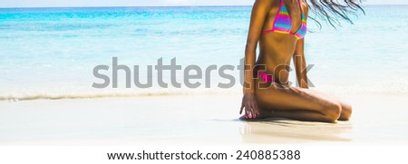 Full length body young adult erotic girl on tropical beach with white hot wet sand Cute woman sit in waves warm water texture ocean or sea Female wearing colorful pink swimsuit against yacht