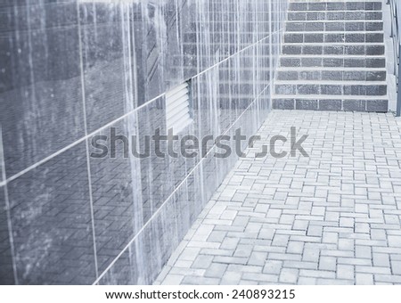 Backdrop of stairway Concept or conceptual white gray stone or concrete stair or steps near brick wall with reflection background with stone No people building background