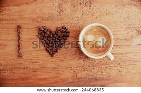 i love coffee, font type Cup of fresh coffee foam cappuccino with heart sign on old retro vintage aged wooden texture board table Good morning background