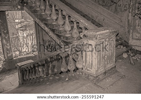 old retro vintage aged abandoned concrete Stairway background Building interior revealed after part of structure collapsed Stairs against window frame Winter tree on street