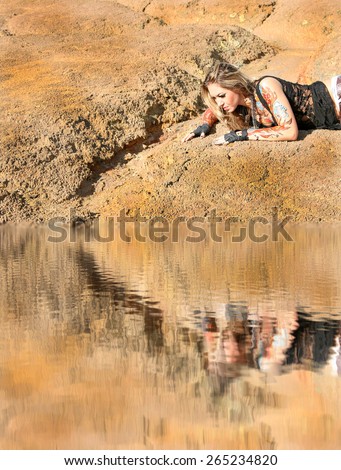 woman lie on dry dead land desert Sad girl seek on earth search fresh water in cracked soil by drought idea of ecology and environmental pollution and scarcity Reflection on liquid texture