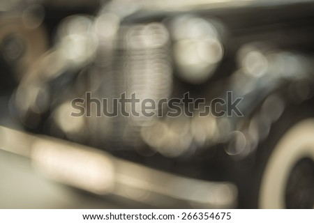 blur background,  in town street with parked old retro vintage aged black dark cars De focused backdrop