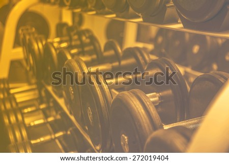 Sport Background of Rack of dumbbells in health club  Shelf with metal on gym studio room backdrop Empty space for sporty inscription Idea symbol concept healthy lifestyle