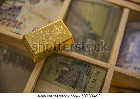wooden section in Safe overflowing full of Swiss gold bullion 999.9 trial and money bill The idea of the budgets of the different nation and the country\'s gold reserves Empty space for inscription