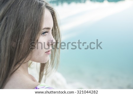 Beautiful cute Woman. Close Up Portrait. Beauty young adult sad girl look at war away. Female think about something and enjoying on  beach coast. Empty copy space for inscription White and black