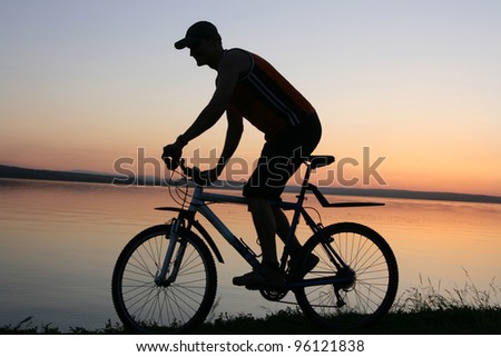 woman mountain bike sunset silhouette
