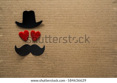 Happy Father\'s day background or card. black sign of hat, mustache and pipe with two red heart - eyes. empty copy space for inscription.