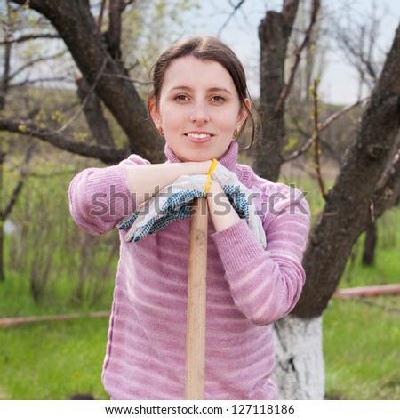 Young woman working in the garden. Garden works. Horticulture