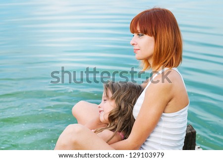 Happy family. Happy mother and daughter together outdoors. Conceptual idea - child care. Happy people