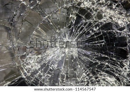 a large glass pane  broken in pieces