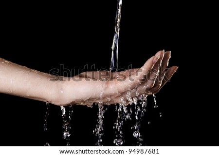stream of water falling into the hands of