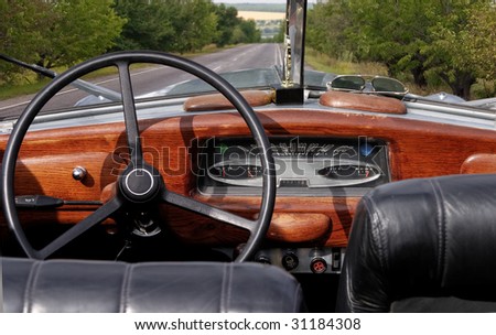 stock photo Wheel and dashboard of a old car