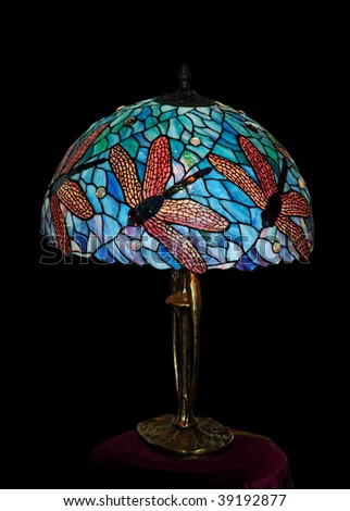 Stained glass desktop lamp isolated on black with clipping path