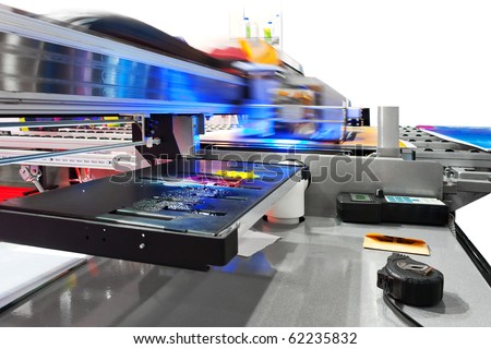Working industrial large format UV inkjet printer for printing on big sheets of plastic or billboards isolated over white