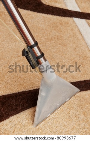 Washing carpet with vacuum cleaner