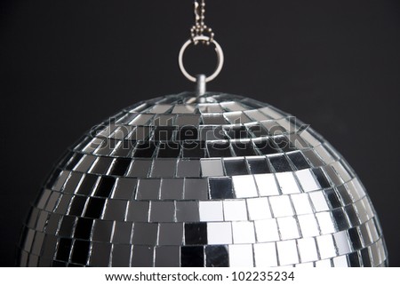disco ball with small mirrors on dark background