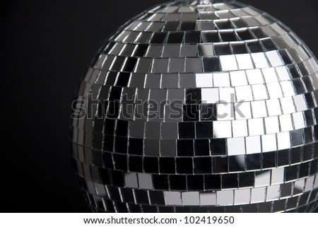 disco ball with small mirrors on dark background