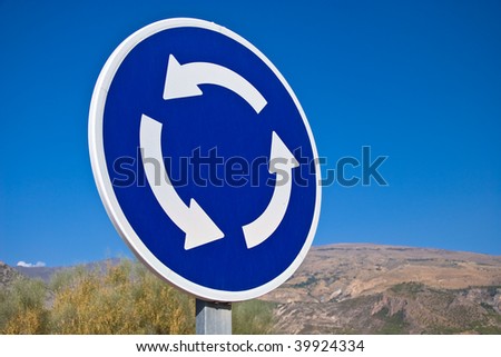 Circular crossroad sign