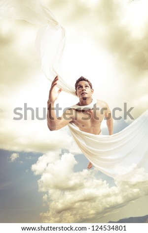 Male angel flying on sky background.