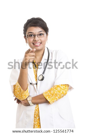 Cheerful Indian young female doctor on white.
