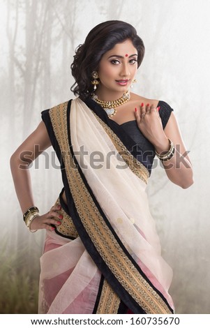 Beautiful Indian Girl With Jewelry In Studio Shoot.