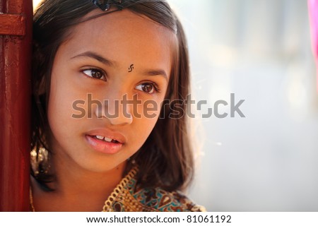 Indian girl looking some where in outdoor / Indian girl / Indian girl