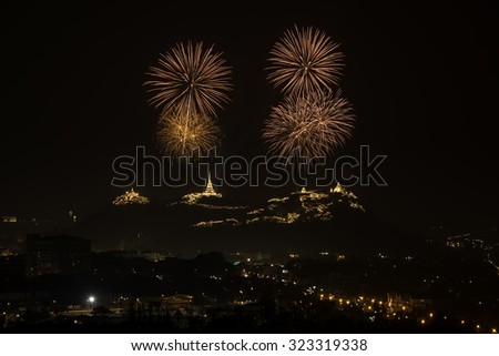 Firework with 3 ancient pagodas on mountain in night sky