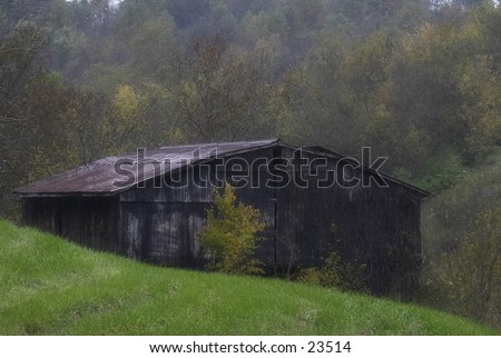 A barn on a rainy, fall day.
