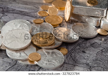 Gold & Silver Coins with Silver Bars on map