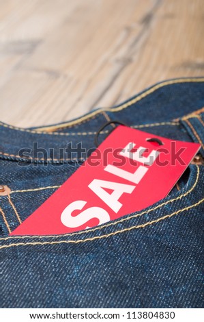 Red Sale Tag in Pocket of Blue Jeans