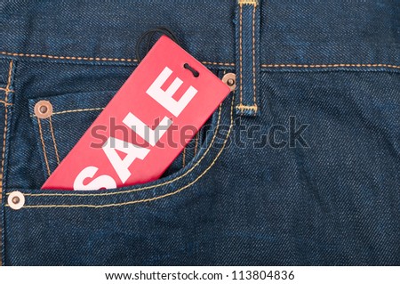 Red Sale Tag in Pocket of Blue Jeans