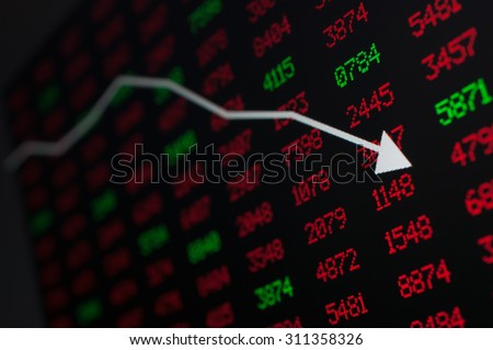 Stock Market - Arrow Graph Going Down on Display With Red and Green Figures