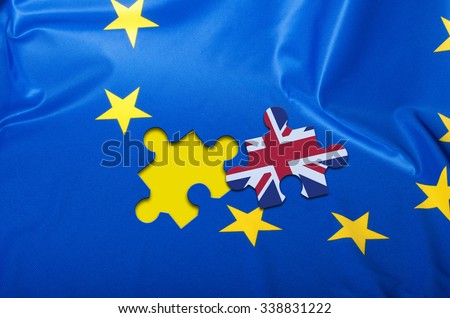 Brexit - Detail of Silky Flag of Blue European Union EU Flag Drapery With Puzzle Piece With Great Britain