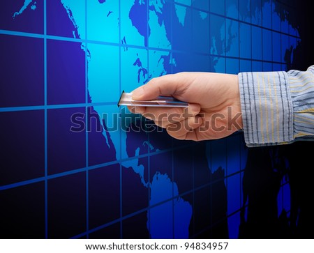 E-Commerce: Mans Hand With Credit Card and Map of World