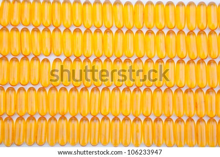 Rows of golden gel capsules