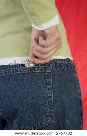 Woman with quarter in back pocket