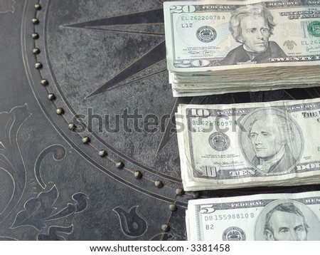 Stacks of cash on bronze table top