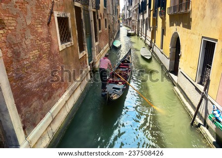 gondolier on the way to the grand canal, venice, italy