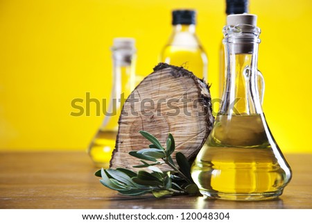 Fresh olives, olive oil on olive wood. Extra virgin