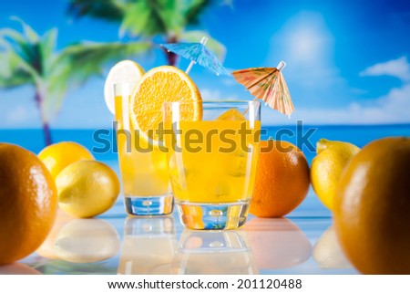 Tropical drinks on beach and sun