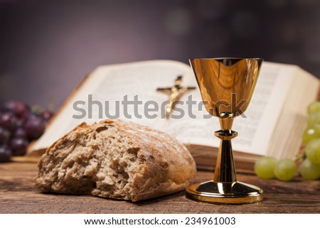 Sacred objects, bible, bread and wine.