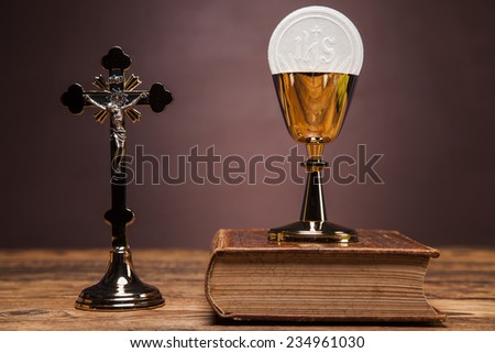 Sacred objects, bible, bread and wine.