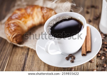 Delicious coffee with sweets on a wooden table, studio shoot