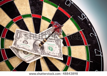 money concept on dartboard