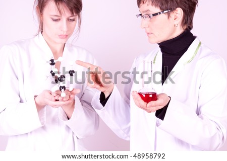Scientist Teaching her assistant